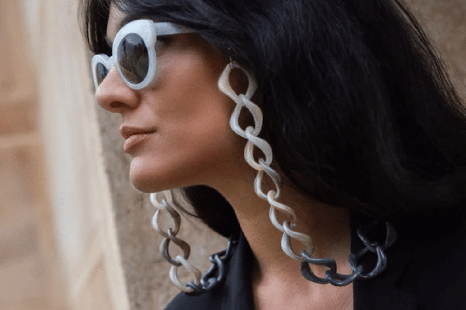 long-haired woman wearing eyeglass with fashionable eyeglass chain